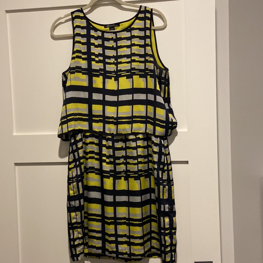 Kenneth Cole one piece dress.   Lined with top over hanging bottom.